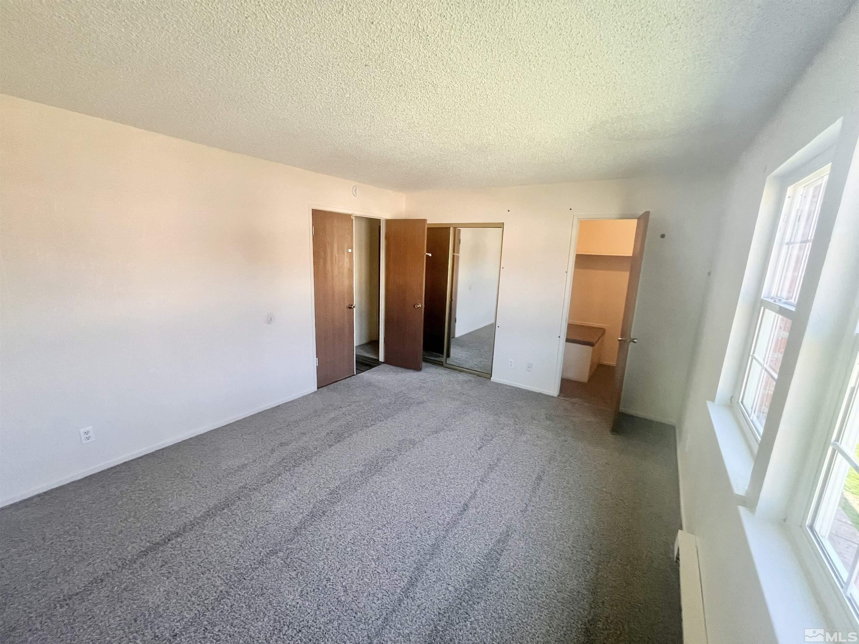 445 Pine Meadows Drive, Unit 29 Sparks, NV 89431 - Photo 11 of 13 a view of hallway with furniture and wooden floor