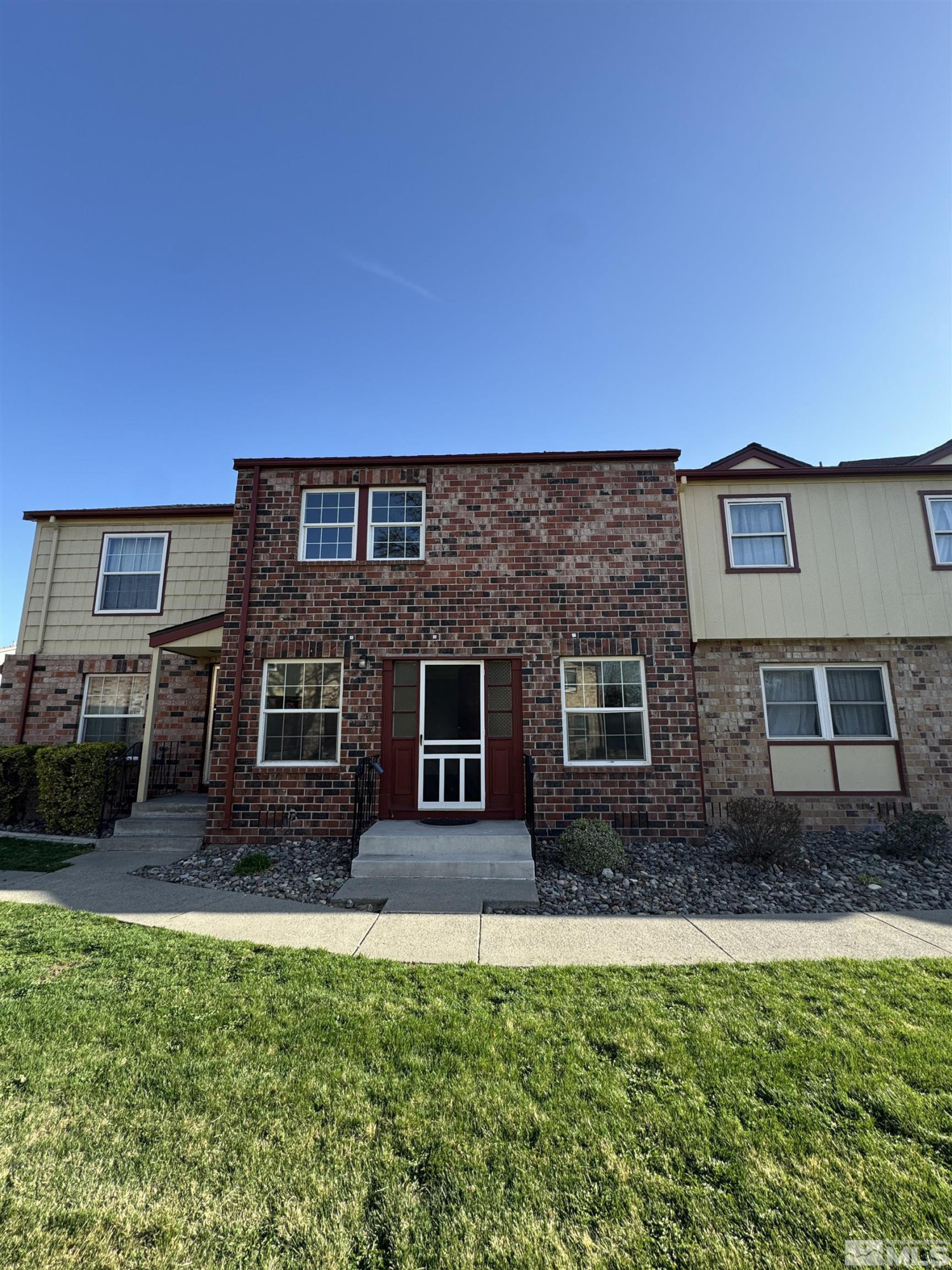 445 Pine Meadows Drive, Unit 29 Sparks, NV 89431 - Photo 2 of 13 a house view with a garden space