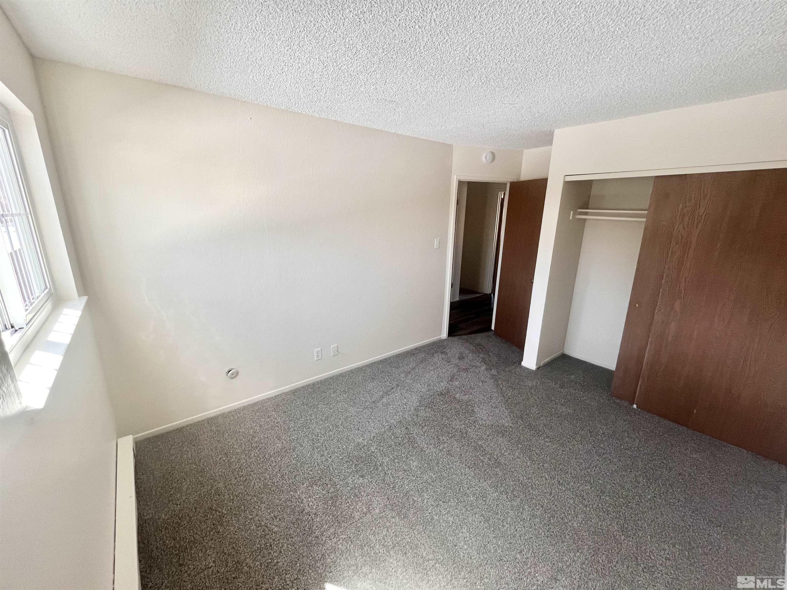 445 Pine Meadows Drive, Unit 29 Sparks, NV 89431 - Photo 9 of 13 a view of room with walk in closet