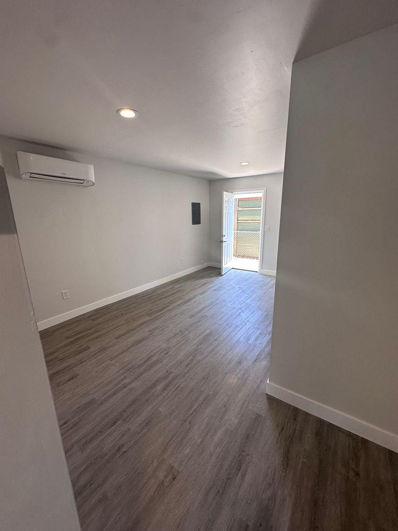 454 Colin Kelly Drive Roseville, CA 95747 - Photo 10 of 13 wooden floor in an empty room with a window