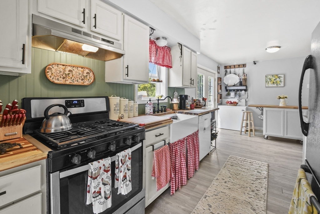 a kitchen with stainless steel appliances granite countertop a stove and a sink