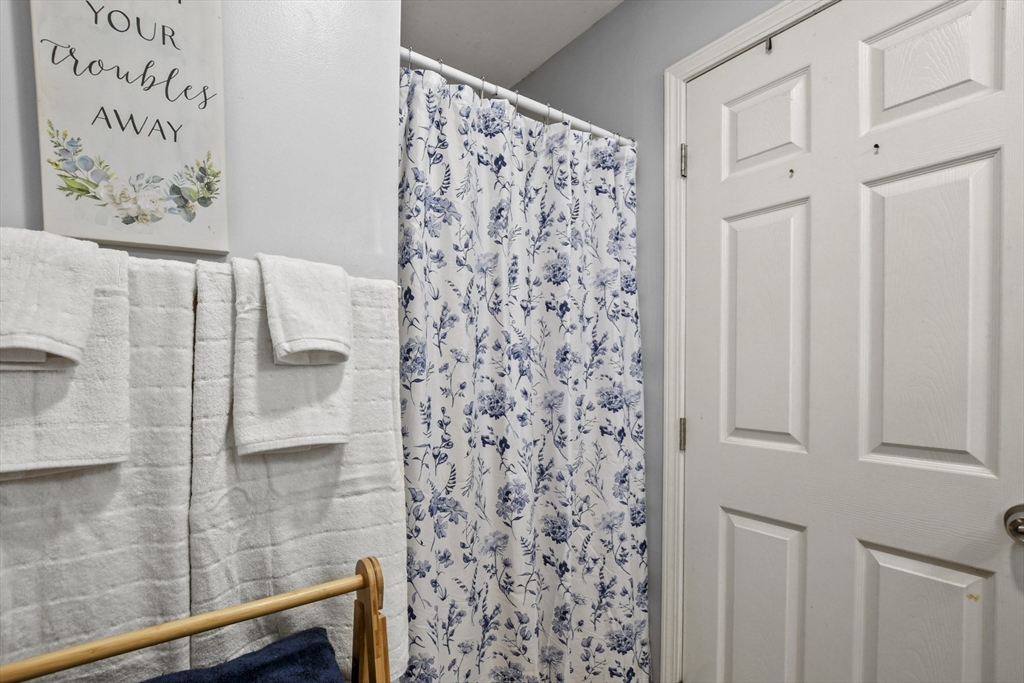 2792 Hancock Road Hancock, MA 01237 - Photo 12 of 38 a bathroom with a shower curtain and a shower curtain