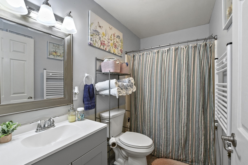 2792 Hancock Road Hancock, MA 01237 - Photo 17 of 38 a bathroom with a sink vanity mirror and toilet