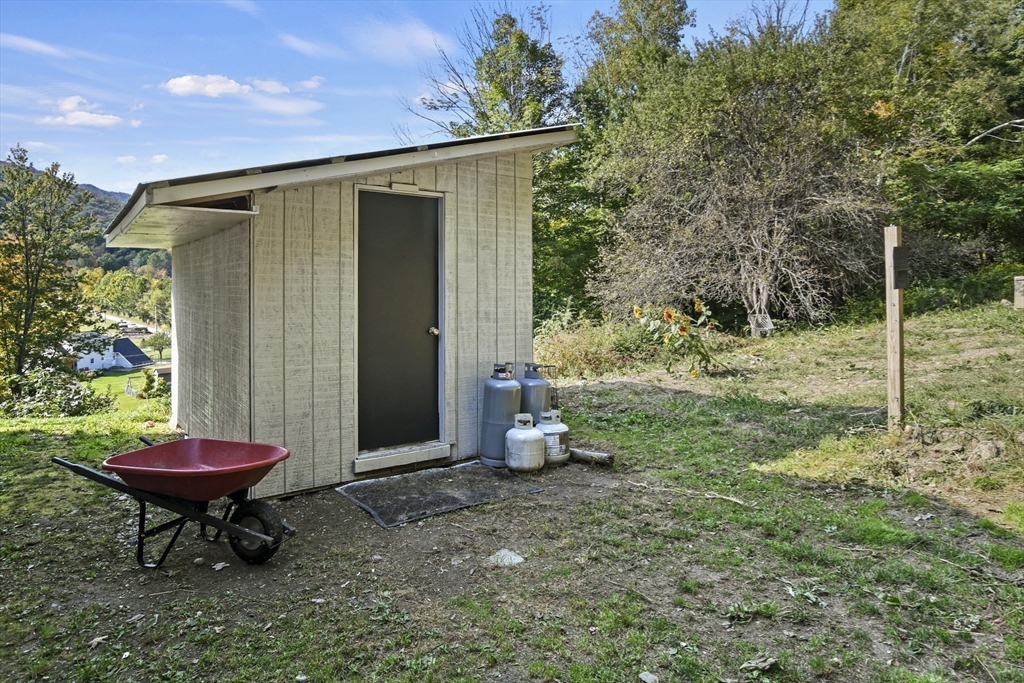 2792 Hancock Road Hancock, MA 01237 - Photo 23 of 38 a backyard of a house with table and chairs