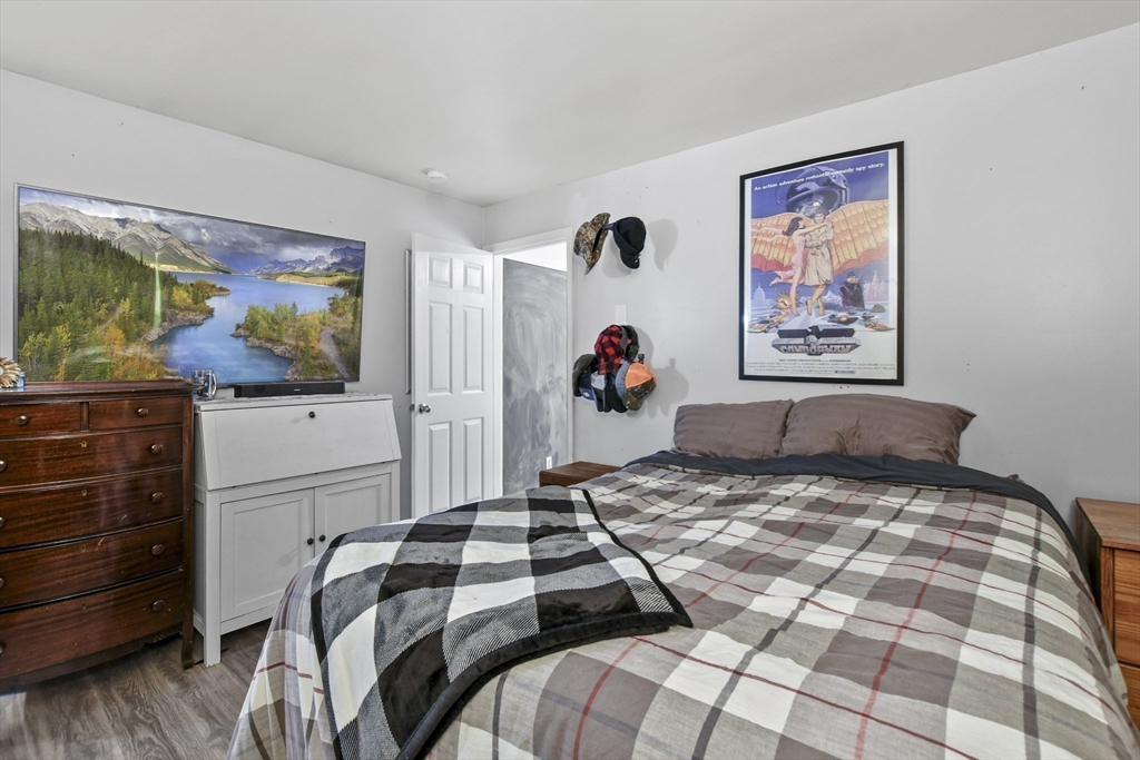 2792 Hancock Road Hancock, MA 01237 - Photo 10 of 38 a bedroom with a bed and a flat screen tv
