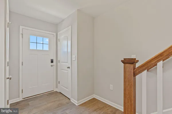 a view of an entryway with wooden floor