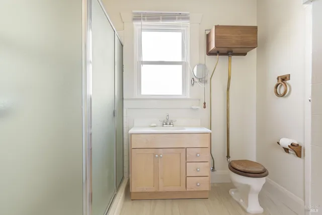 a bathroom with a sink mirror and vanity