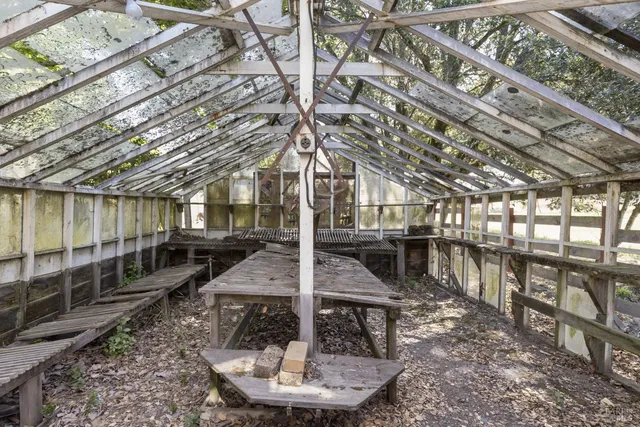 a view of balcony with wooden floor