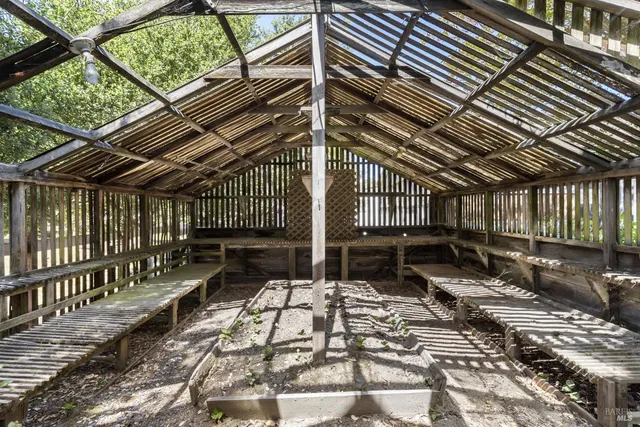 a view of a wooden door and a window