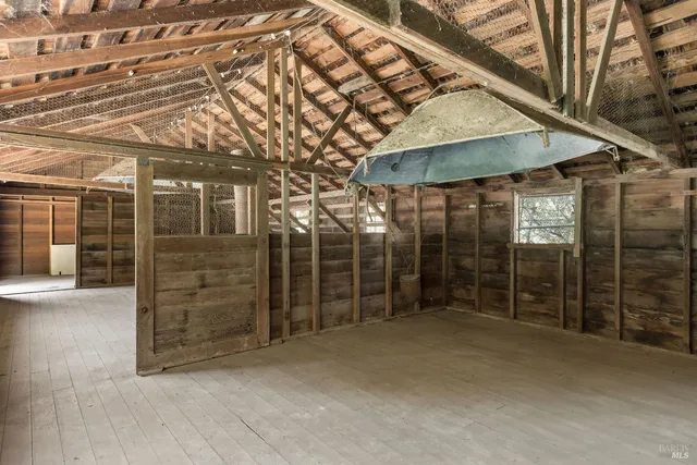 an empty room with wooden floor