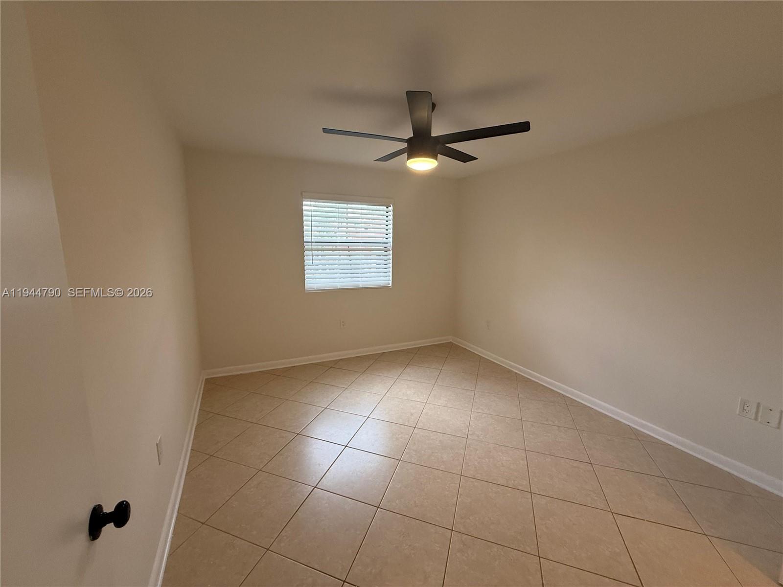 15581 Southwest 104th Terrace, Unit 222 Miami, FL 33196 - Photo 18 of 23 a view of an empty room with a window