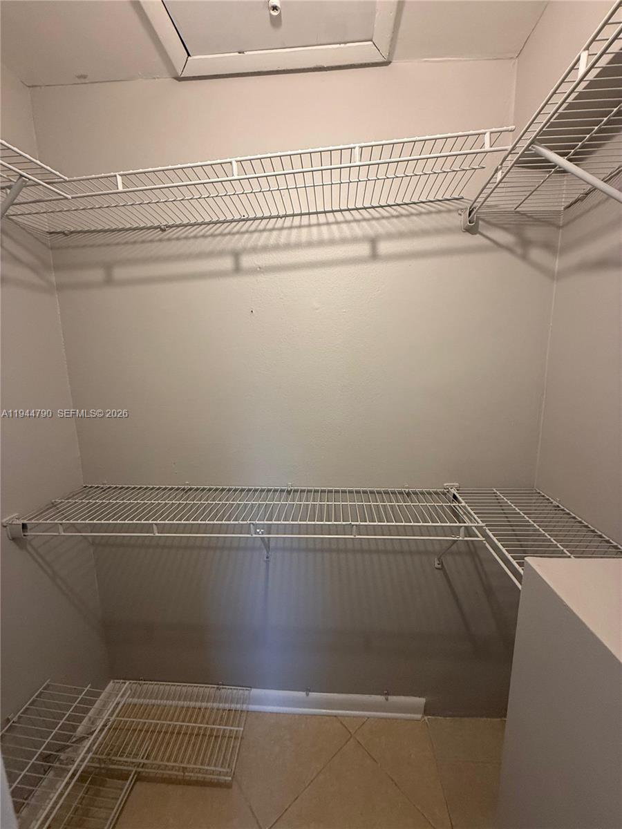 15581 Southwest 104th Terrace, Unit 222 Miami, FL 33196 - Photo 20 of 23 a view of a room with racks on the wall