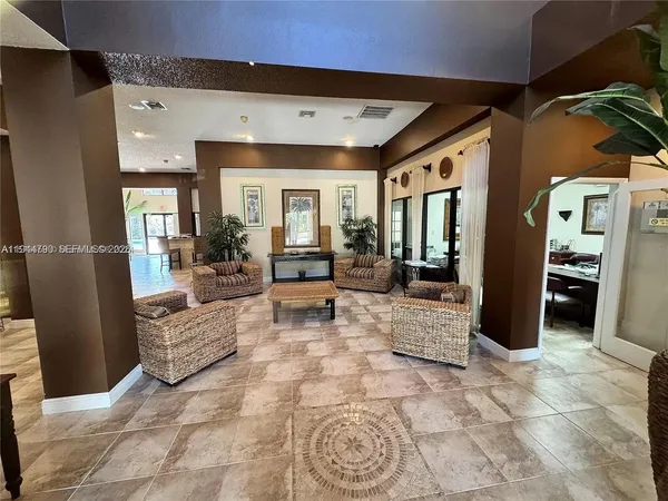 a living room with furniture and a rug