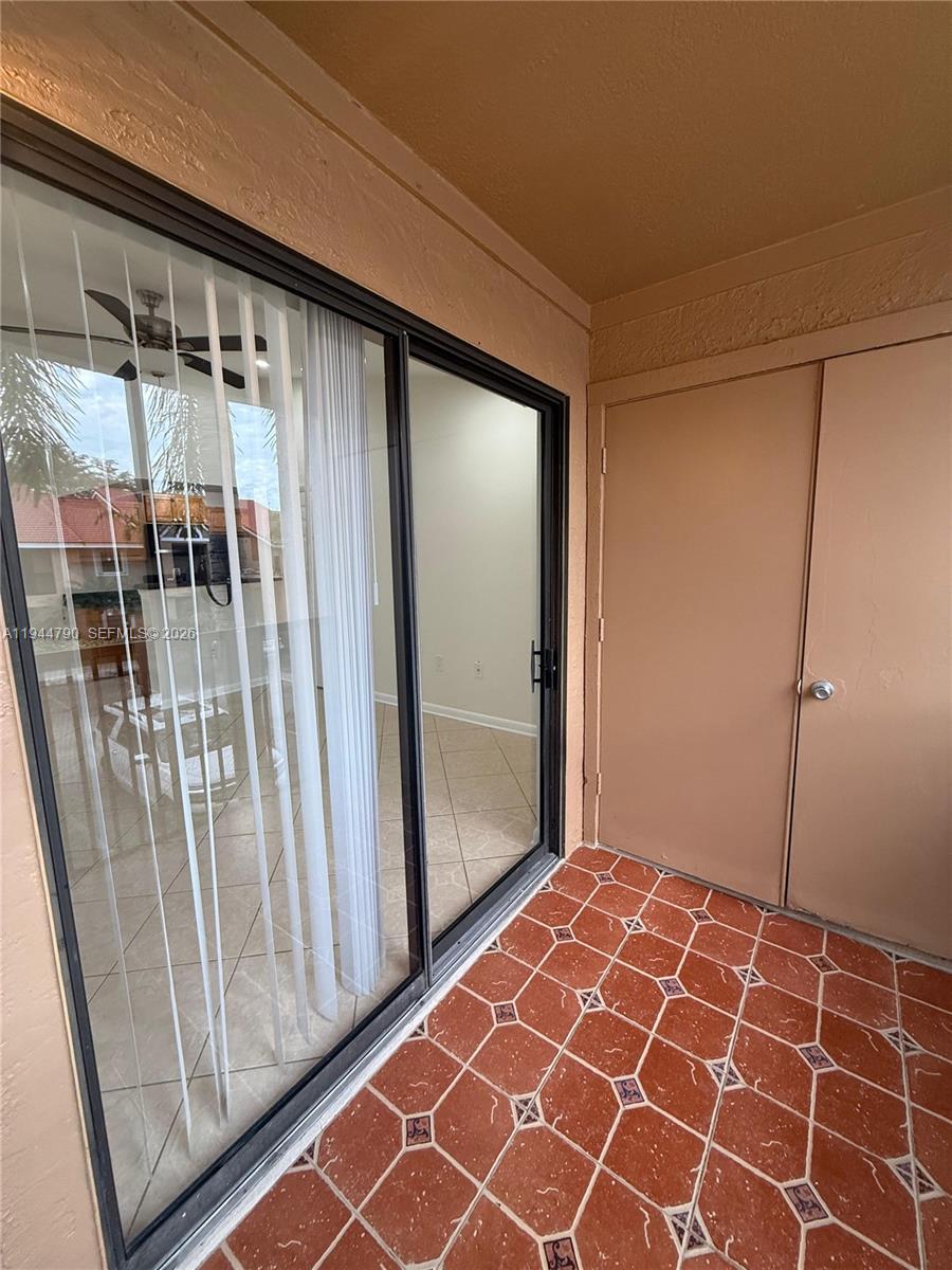 15581 Southwest 104th Terrace, Unit 222 Miami, FL 33196 - Photo 22 of 23 a view of hallway with wooden floor and door