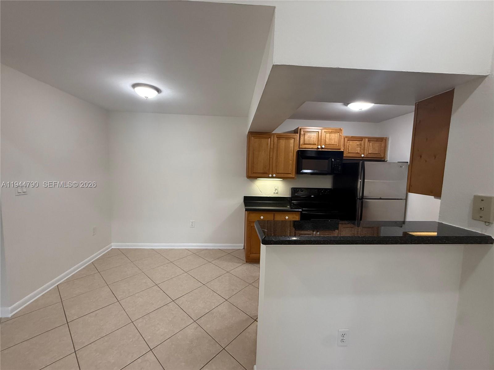 15581 Southwest 104th Terrace, Unit 222 Miami, FL 33196 - Photo 4 of 23 a view of kitchen with cabinets