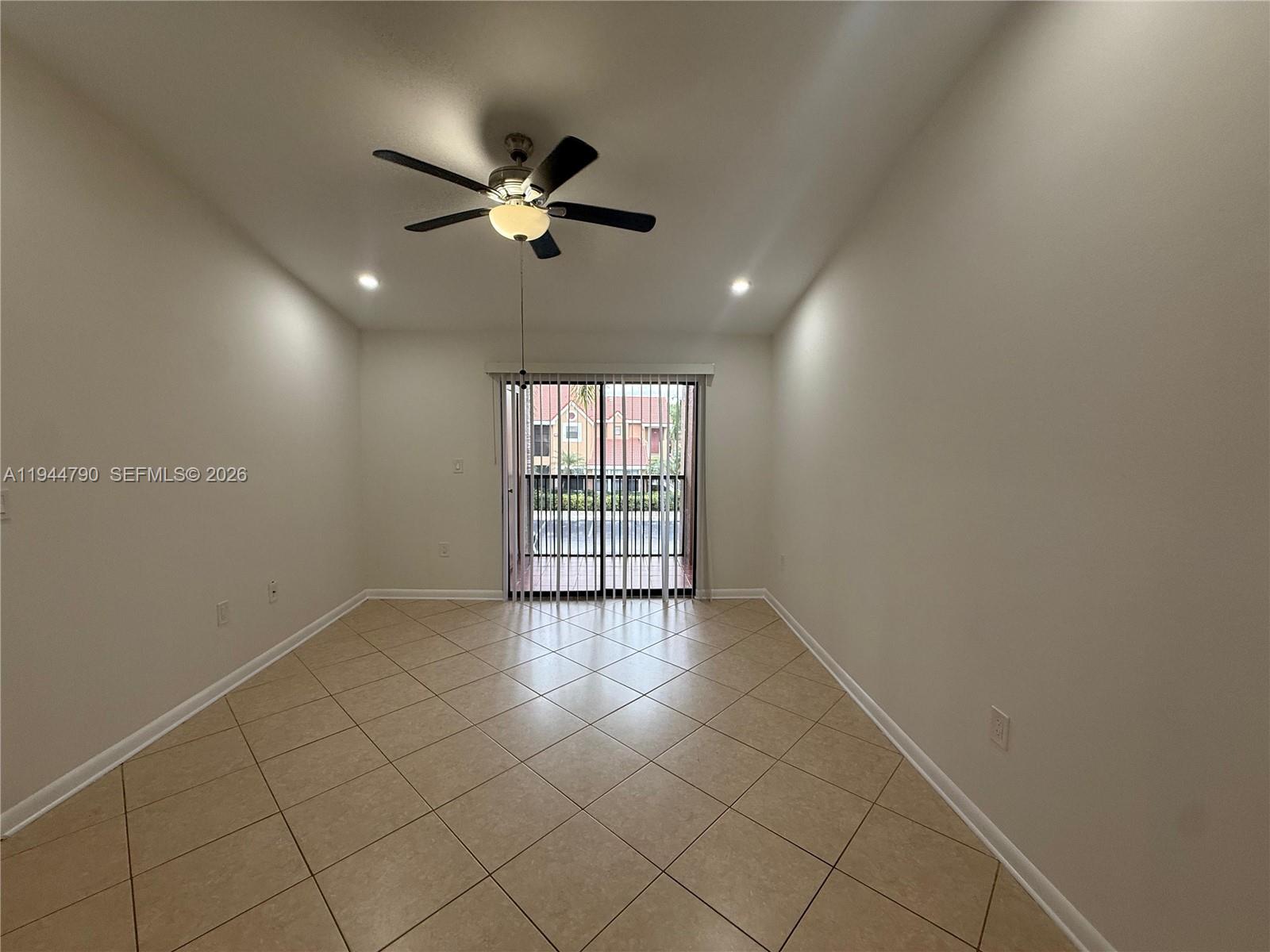 15581 Southwest 104th Terrace, Unit 222 Miami, FL 33196 - Photo 7 of 23 a view of an empty room with a window