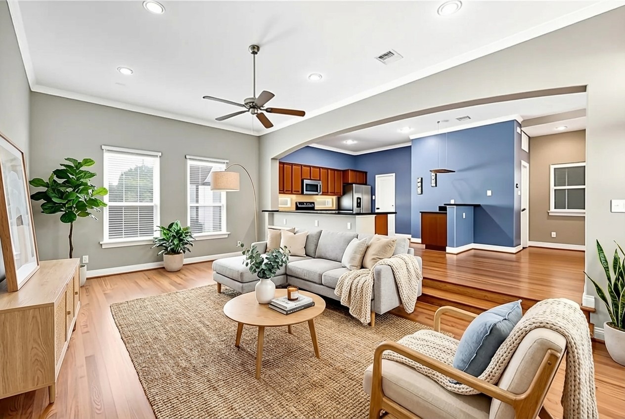 a living room with furniture fireplace and a chandelier