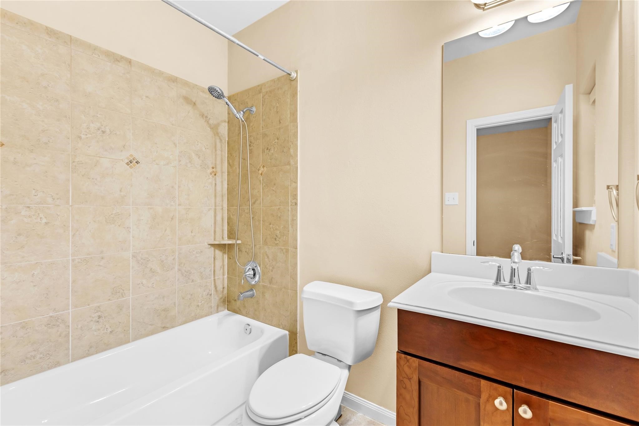 934 West 26th Street, Unit B Houston, TX 77008 - Photo 25 of 33 The first floor bathroom includes a tub/shower combination along with a vanity.