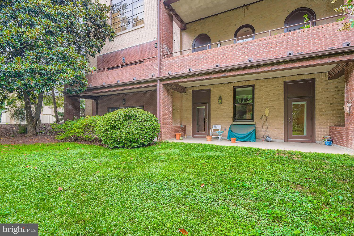 5712 Roland Avenue, Unit TC Baltimore, MD 21210 - Photo 13 of 14 Back patio with shared backyard