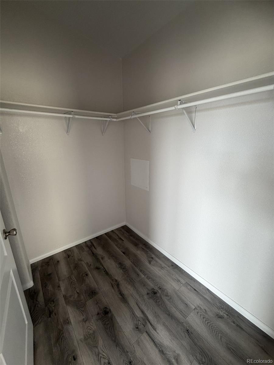5511 Ridgetop Court Alamosa, CO 81101 - Photo 6 of 10 a view of a room with wooden floor