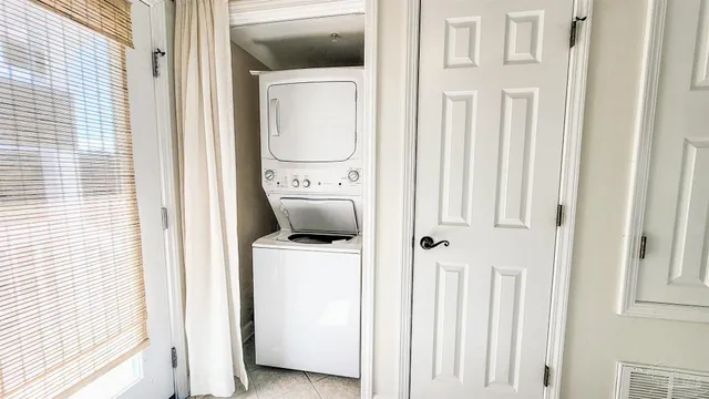 a view of a roof deck with wooden fence and floor