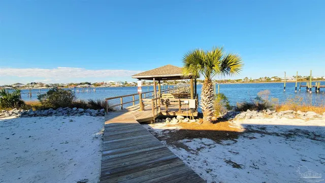 a view of a terrace with a wooden fence