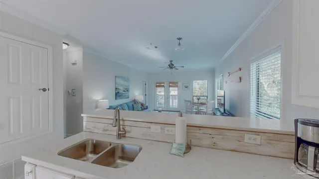 a kitchen with a sink and cabinets