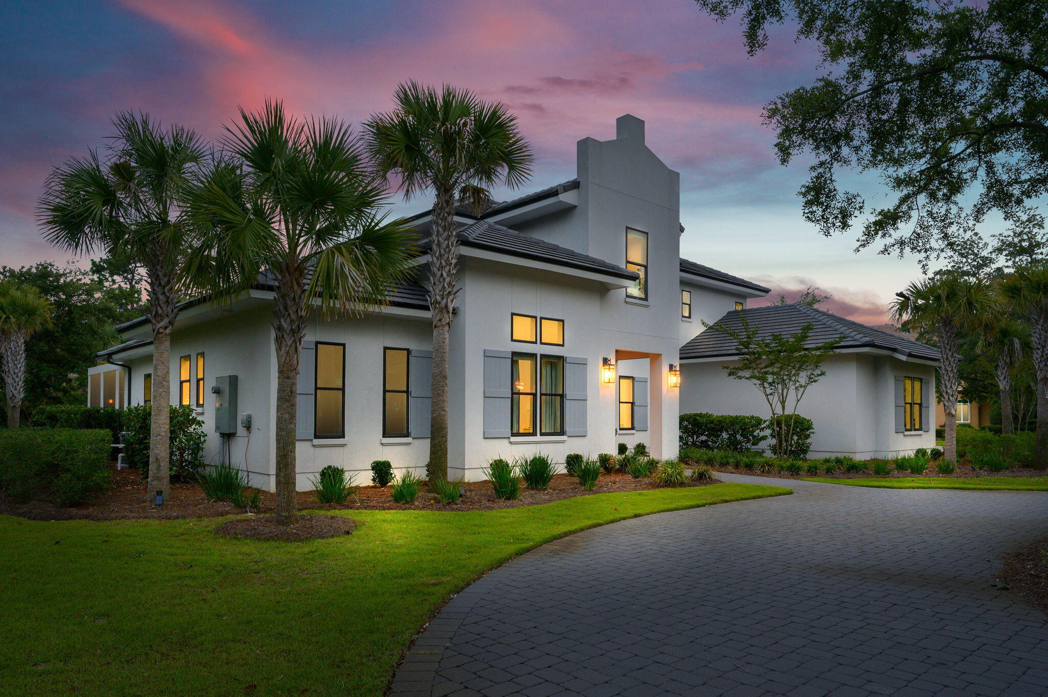 3278 Burnt Pine Circle Miramar Beach, FL 32550 - Photo 2 of 100 a front view of a house with a garden and plants