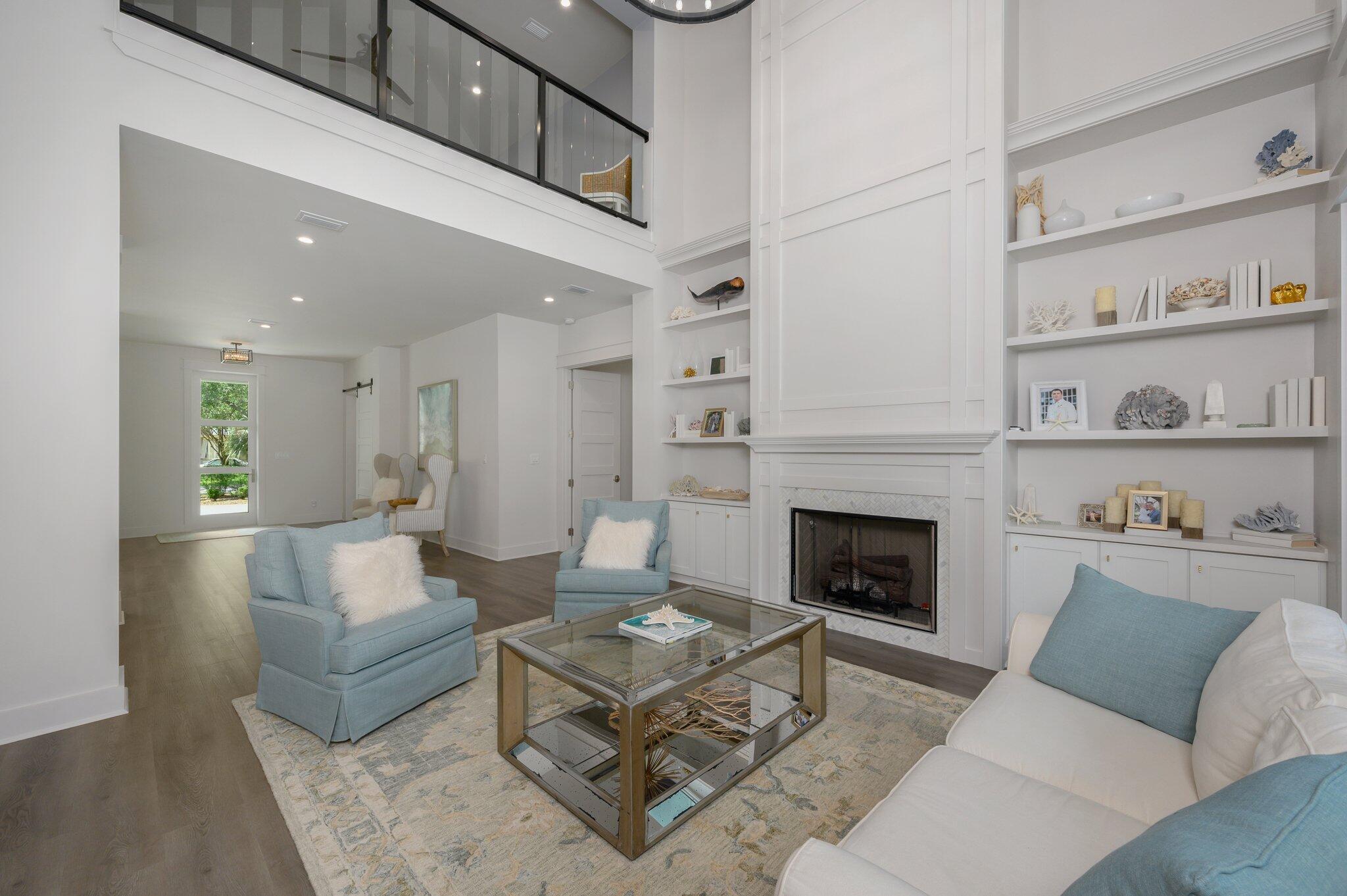 3278 Burnt Pine Circle Miramar Beach, FL 32550 - Photo 32 of 100 a living room with furniture and a fireplace