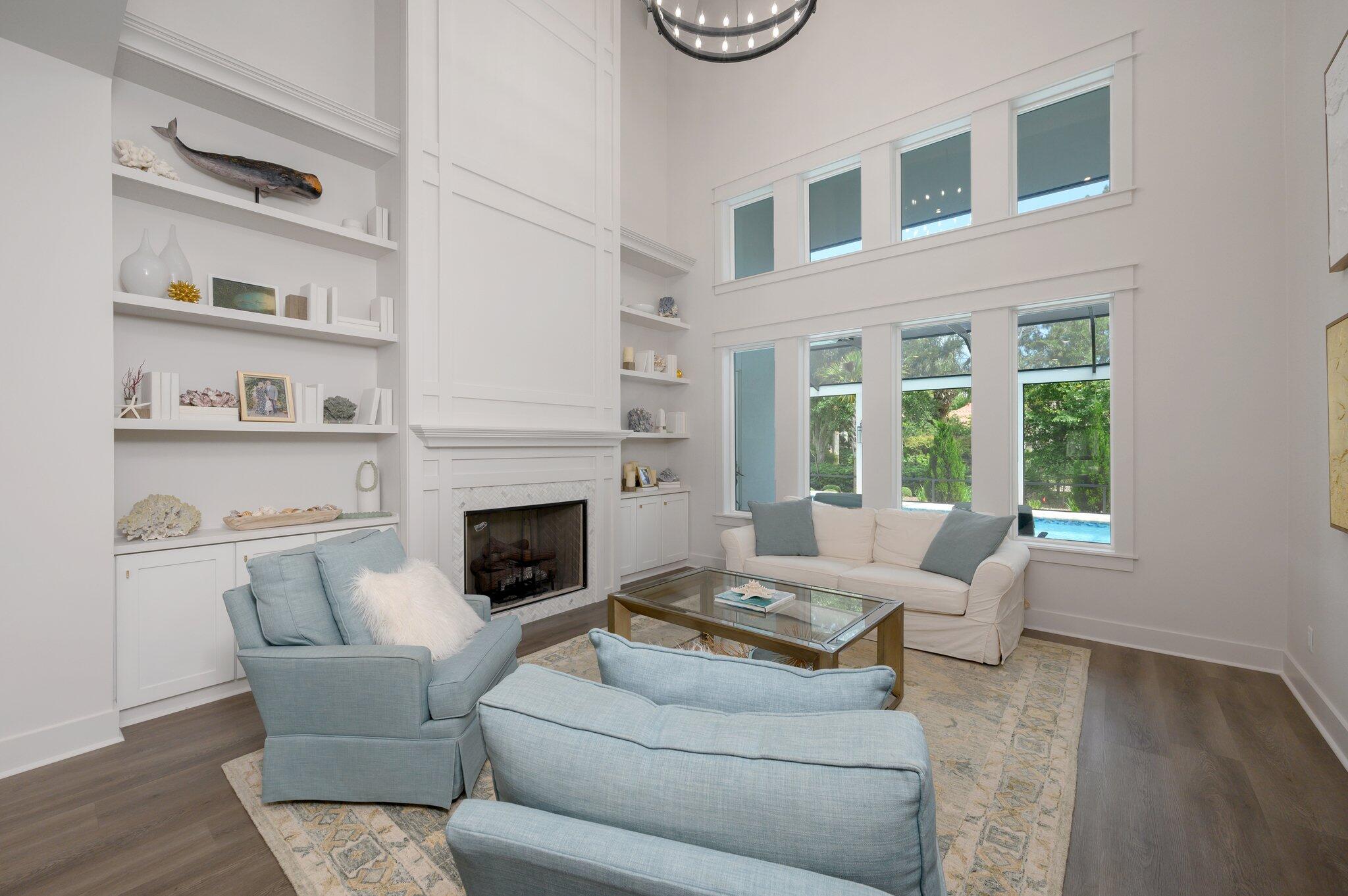 3278 Burnt Pine Circle Miramar Beach, FL 32550 - Photo 34 of 100 a living room with furniture a fireplace and a window