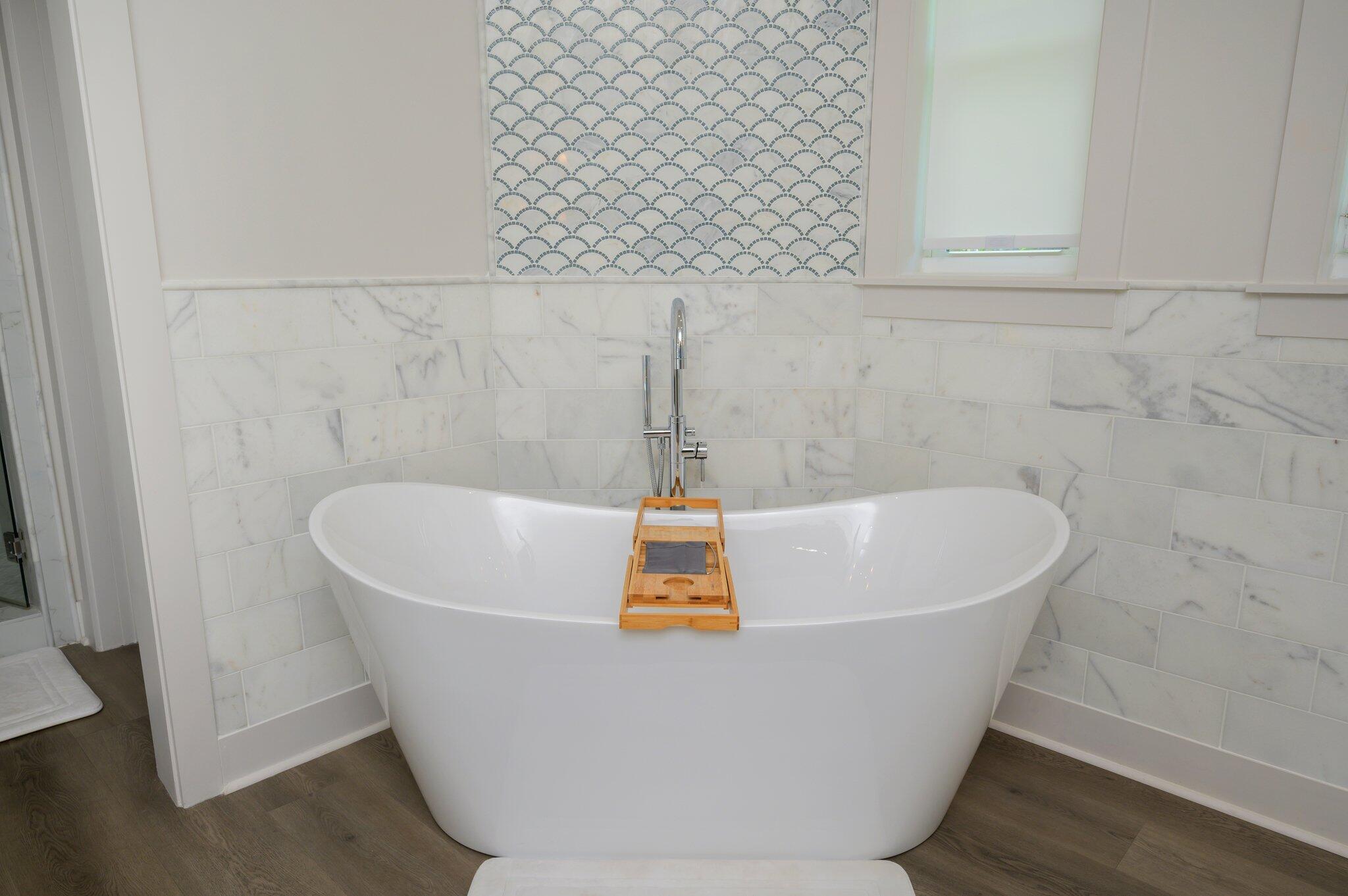 3278 Burnt Pine Circle Miramar Beach, FL 32550 - Photo 46 of 100 a white tub sitting in a bathroom