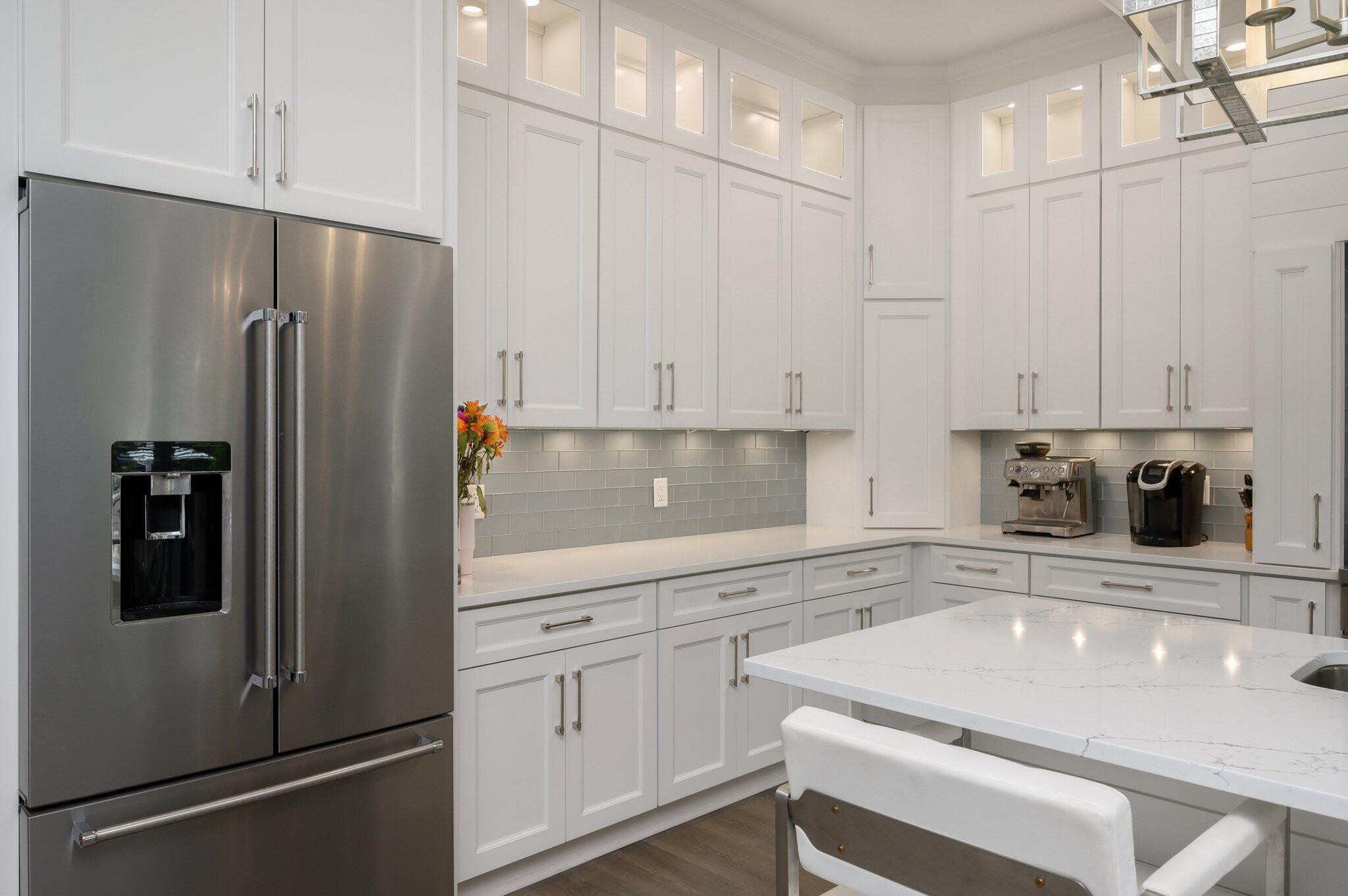 3278 Burnt Pine Circle Miramar Beach, FL 32550 - Photo 55 of 100 a kitchen with stainless steel appliances a refrigerator sink and cabinets