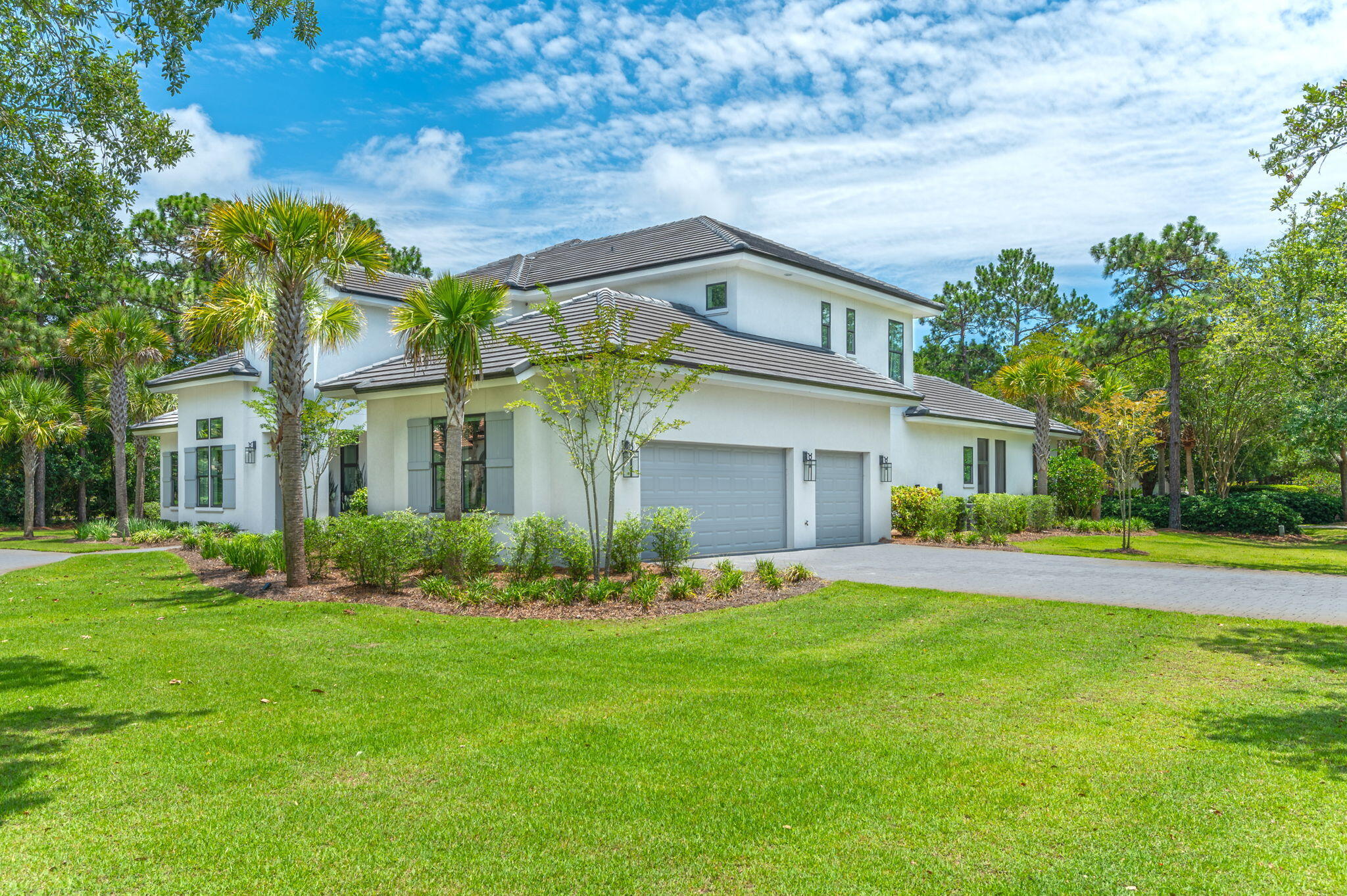 3278 Burnt Pine Circle Miramar Beach, FL 32550 - Photo 6 of 100 a front view of a house with a yard and trees