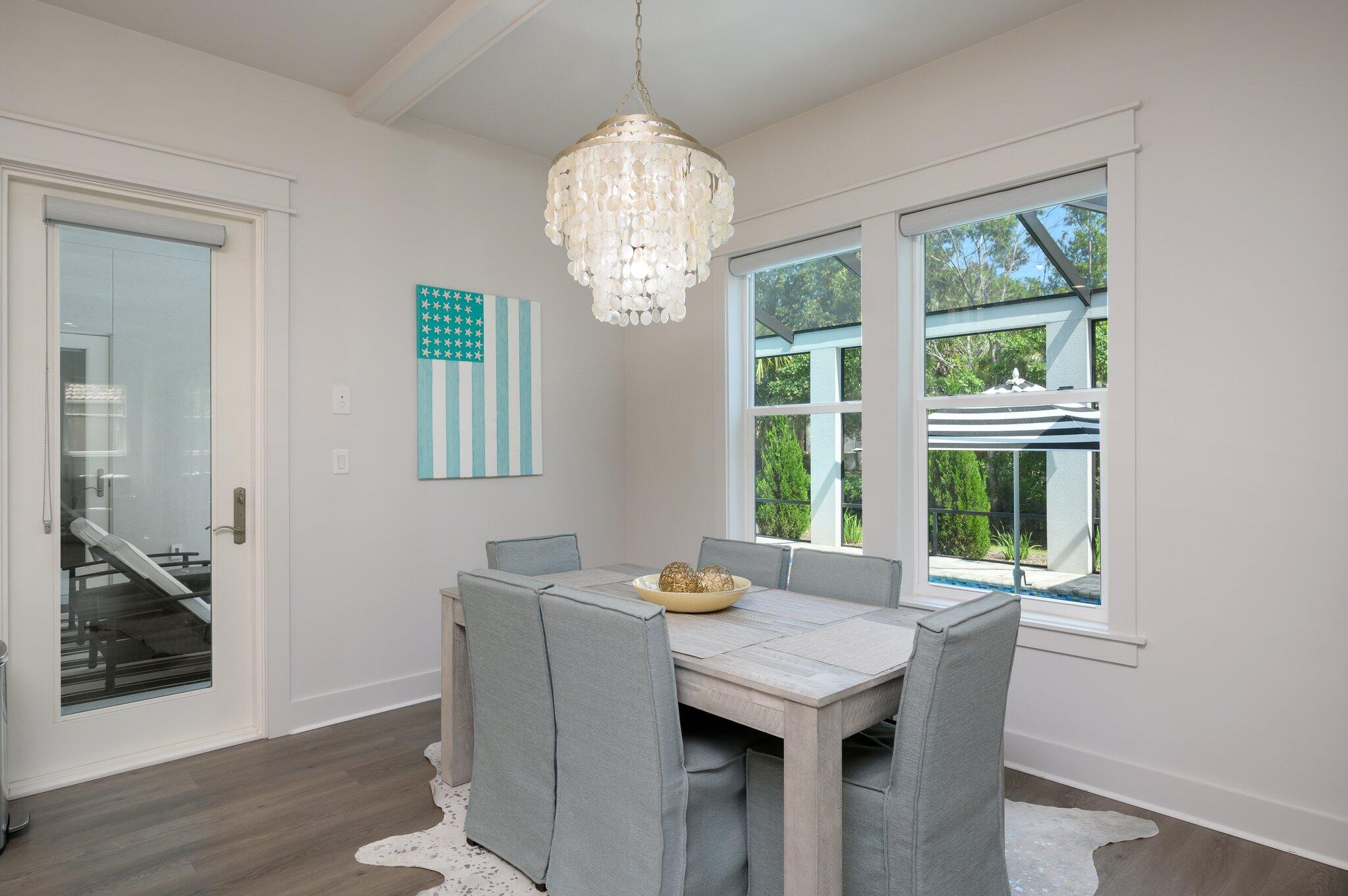 3278 Burnt Pine Circle Miramar Beach, FL 32550 - Photo 62 of 100 a view of a dining room with furniture wooden floor and chandelier