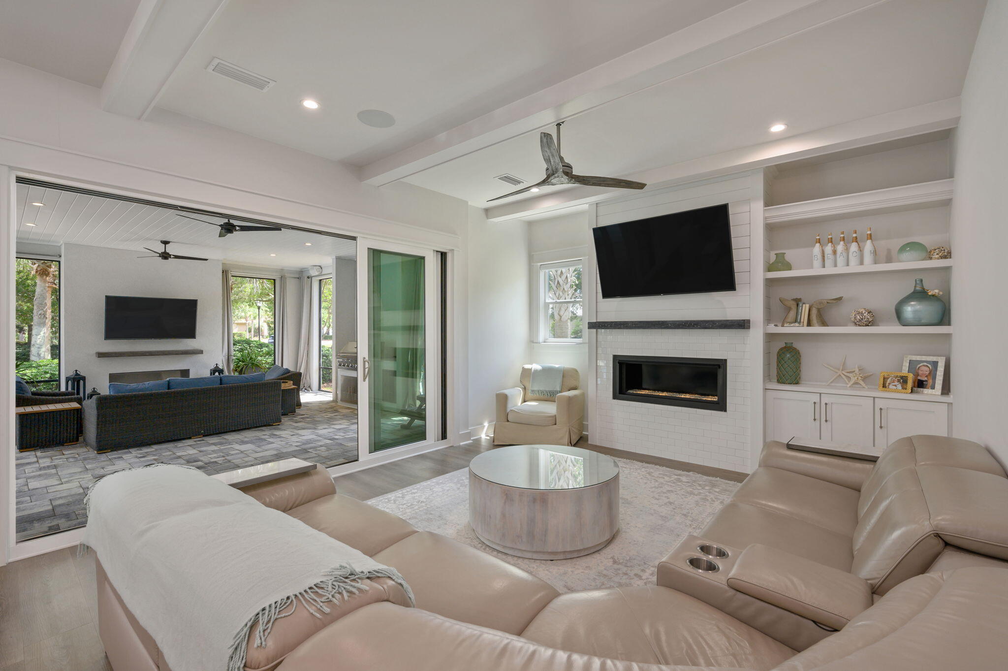 3278 Burnt Pine Circle Miramar Beach, FL 32550 - Photo 64 of 100 a living room with furniture a flat screen tv and a fireplace