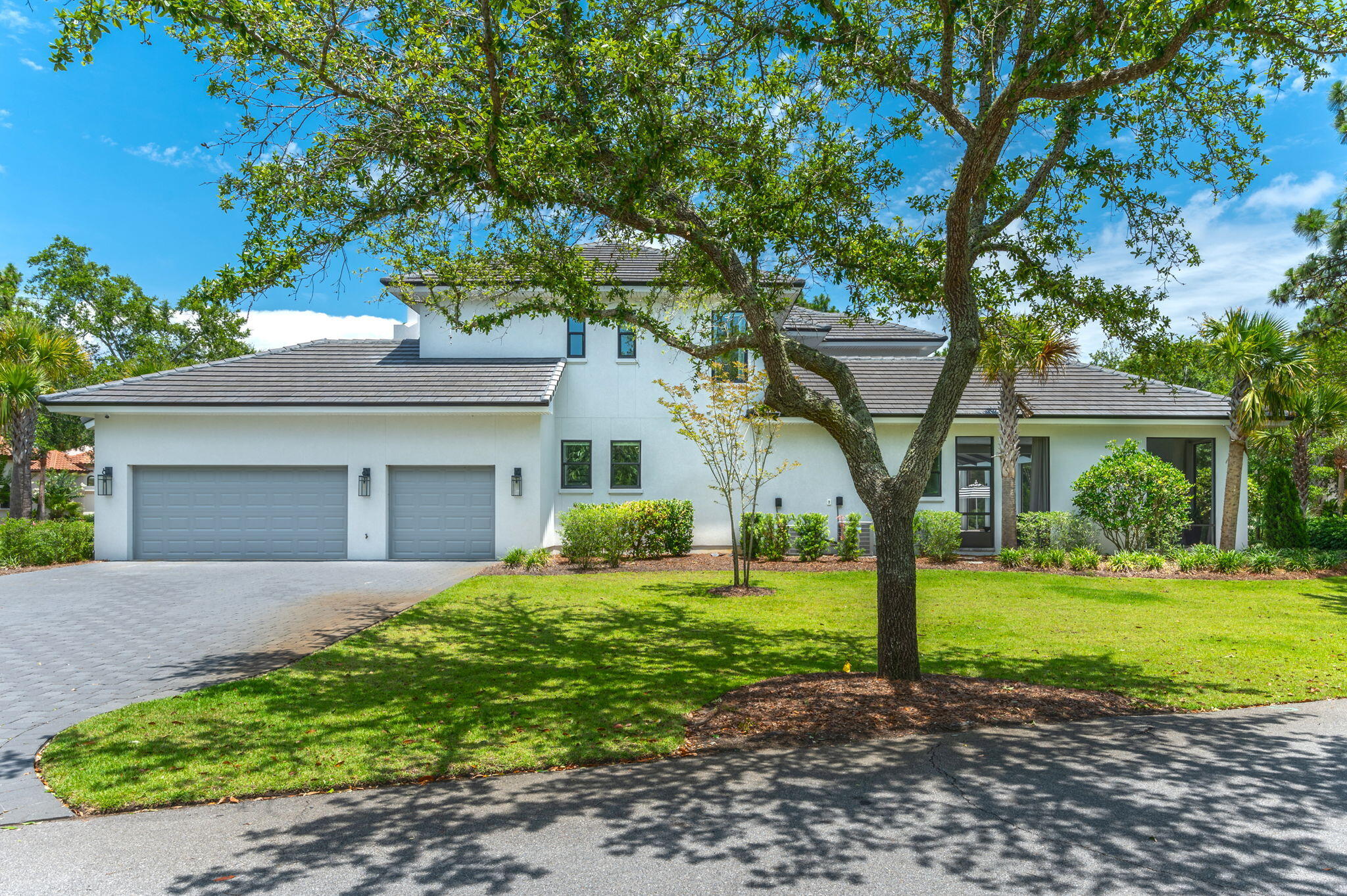 3278 Burnt Pine Circle Miramar Beach, FL 32550 - Photo 7 of 100 a front view of a house with garden