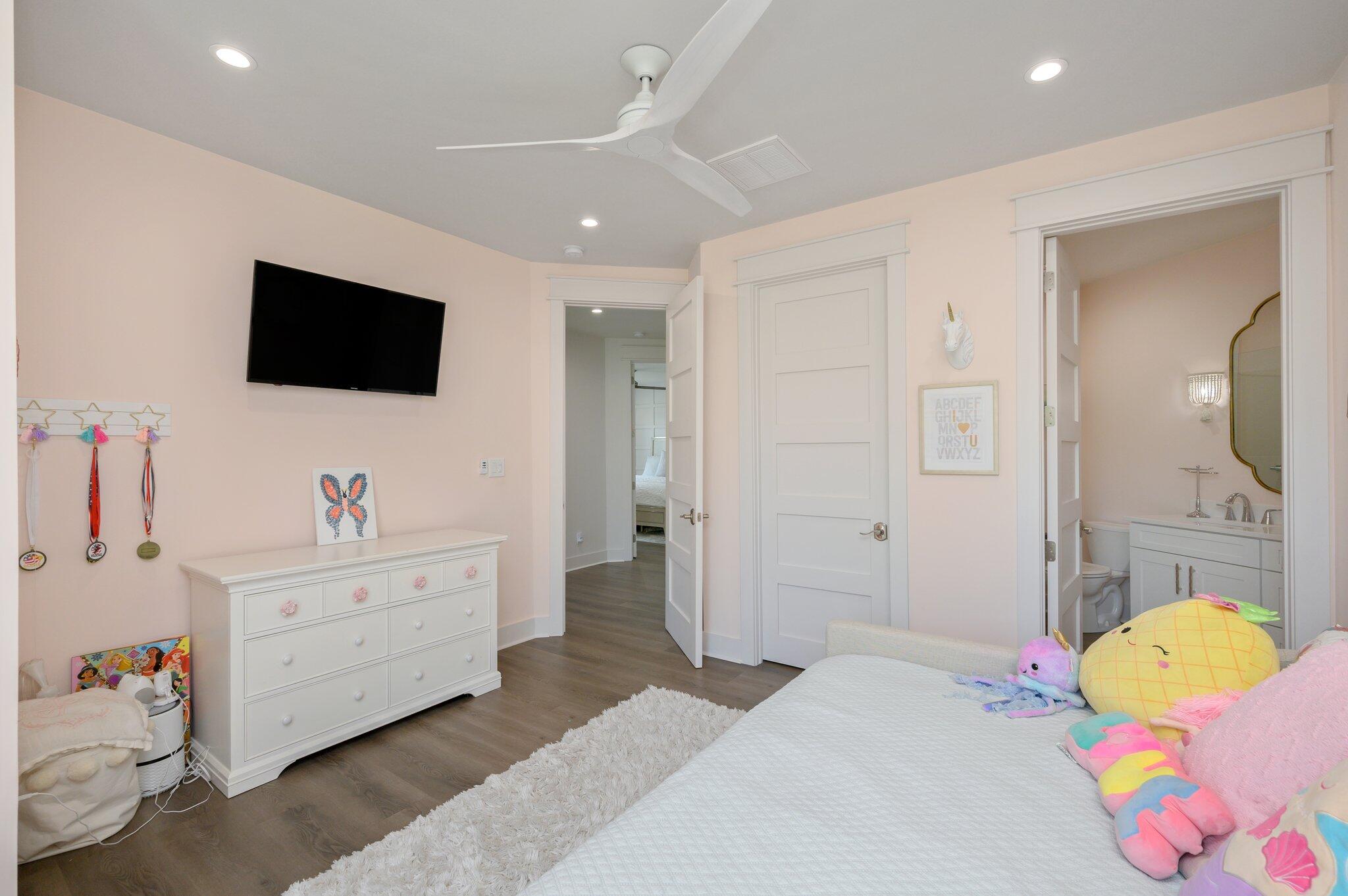 3278 Burnt Pine Circle Miramar Beach, FL 32550 - Photo 74 of 100 a spacious bedroom with a bed and a flat screen tv