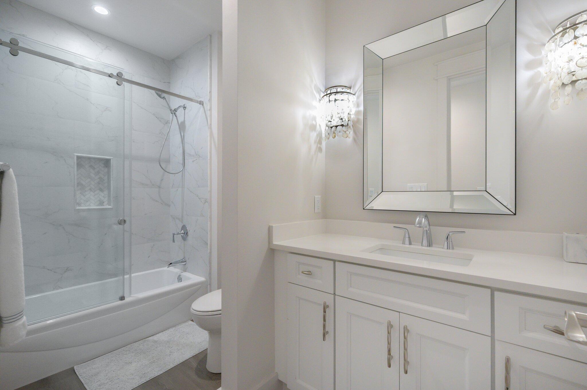 3278 Burnt Pine Circle Miramar Beach, FL 32550 - Photo 85 of 100 a bathroom with a bathtub shower sink vanity and toilet