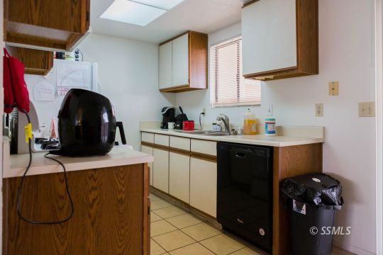 632 West Graaf Avenue Ridgecrest, CA 93555 - Photo 9 of 17 a kitchen with a sink cabinets and appliances