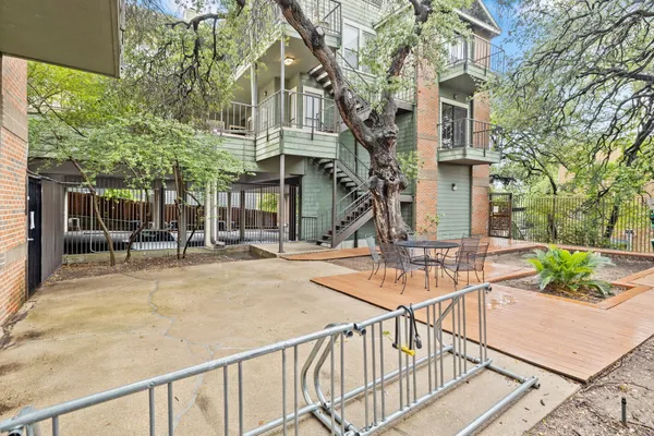 a view of a building with sitting area