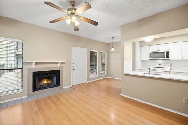 a view of a room with a door and wooden floor