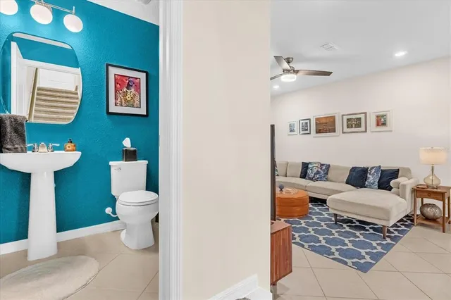 a living room with furniture and a toilet