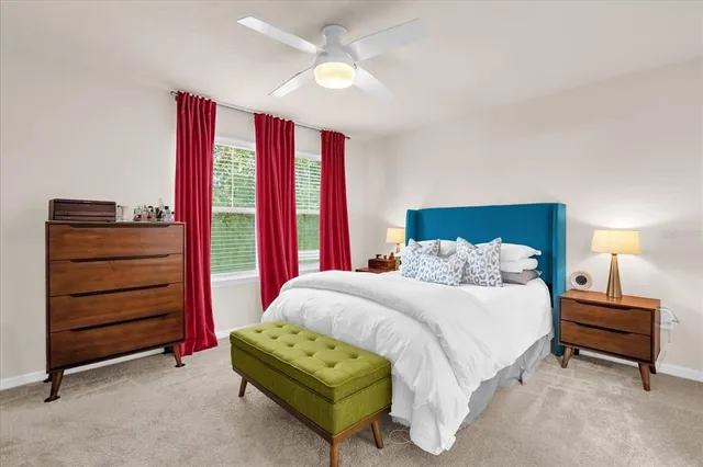 a bedroom with a bed and a dresser