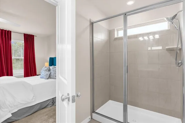 a bathroom with a bathtub and a shower