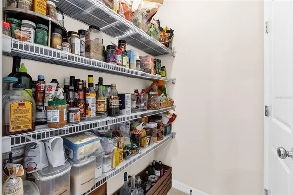 a roof deck with wine bottles and sink on it
