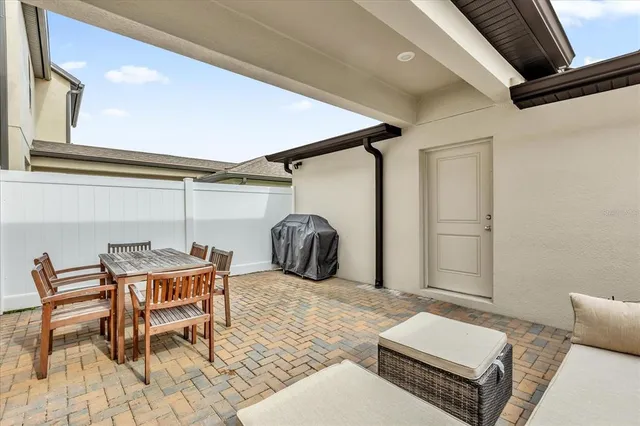 a bedroom with furniture and a rug
