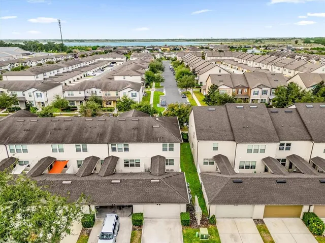 an aerial view of a house with outdoor space