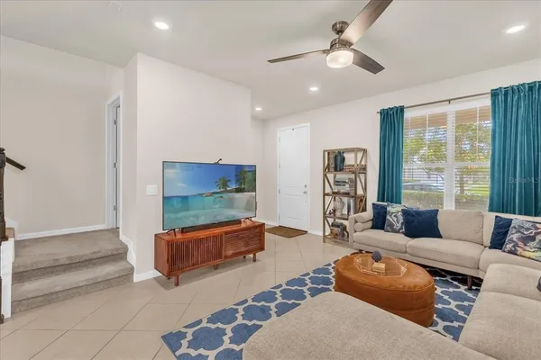a living room with furniture and a flat screen tv