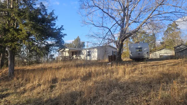 a view of swimming pool next to a yard