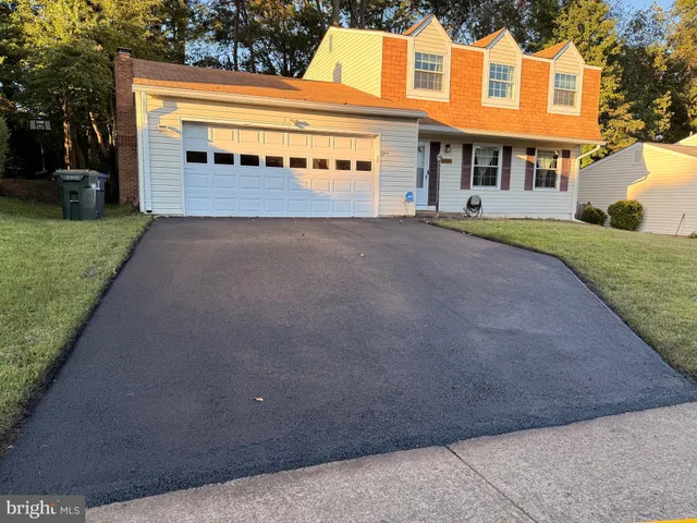 front view of a house with a street